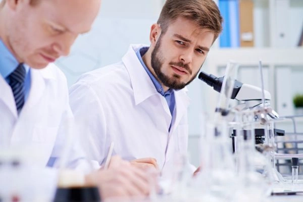 Researchers troubleshooting common laboratory challenges