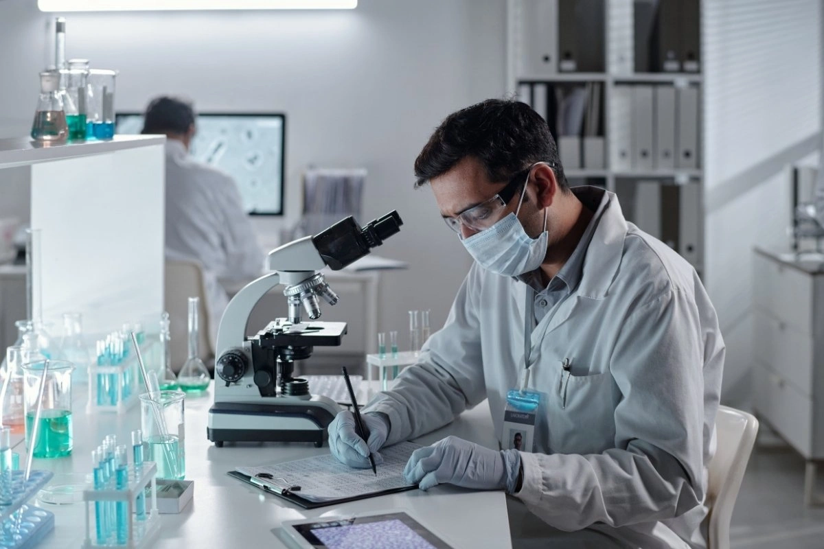 Laboratory scientist preparing NAD+ materials for controlled stability evaluation