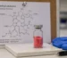 Methylcobalamin crystalline powder vial with molecular structure diagram
