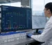 Researcher analyzing HCG glycosylation data in laboratory