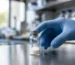 Vial of kisspeptin-10 peptide powder in a lab