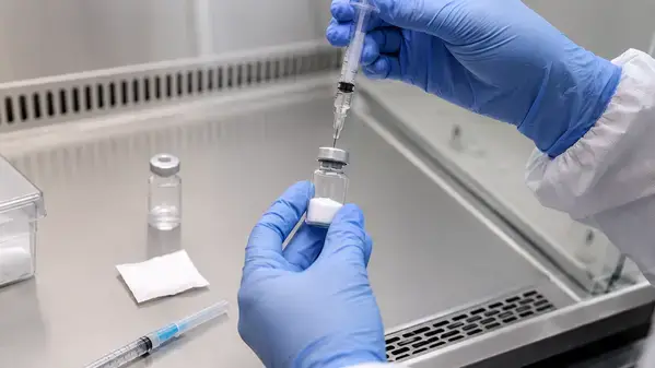 Researcher reconstituting lyophilized melanotan 2 peptide with bacteriostatic water